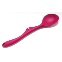 Pink silicone cooking spoon with handle rest