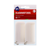 Set of six white combs for professional grooming