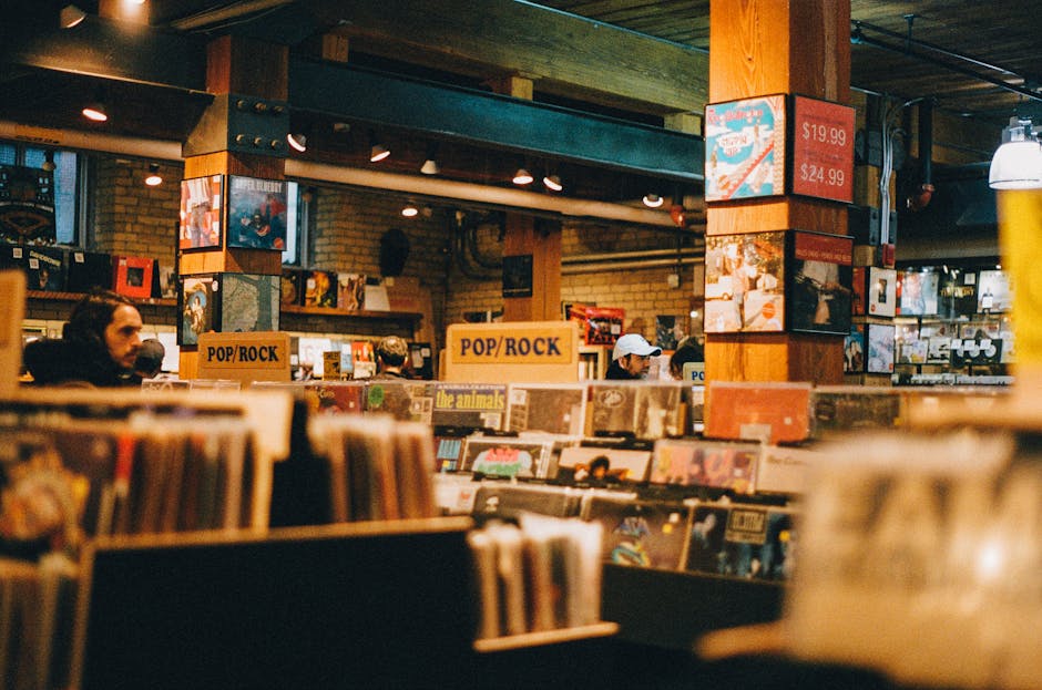 A nostalgic record store interior featuring vinyl displays and warm lighting.